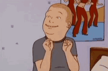 a cartoon character from king of the hill is sitting in front of a picture of a group of women dancing .