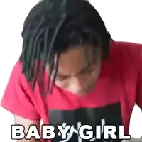 a man with dreadlocks is wearing a red shirt that says baby girl on it .