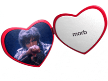 a heart shaped mirror with a picture of a man and the word morb