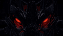 a close up of a transformer with red eyes in the dark .