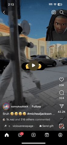 a phone screen shows a video of a man running down the street