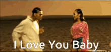 a man and a woman standing on a beach with the words " i love you baby " above them