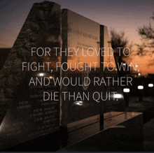 a memorial with the words " for they loved to fight fought to win and would rather die than quit " on it