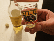 a shot glass that says wyoming on it