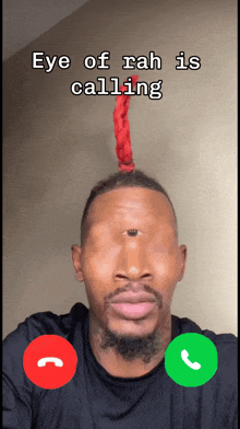 a man with a red rope on his head talking on a cell phone