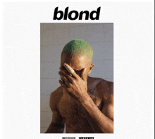 a shirtless man with green hair covers his face on the cover of blond