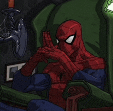 a drawing of a spider man sitting in a chair