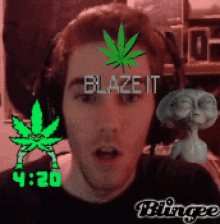 a man wearing headphones has a marijuana leaf on his forehead and the words blaze it written above him