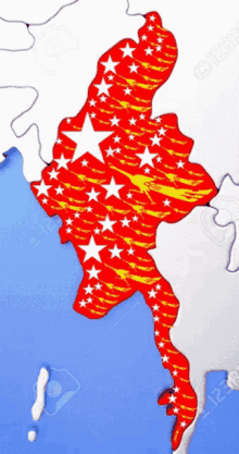 a map of myanmar with red and yellow stars on a blue background