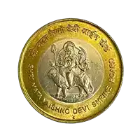 a gold and silver coin that says shri mata vaishno devi shrine board on it