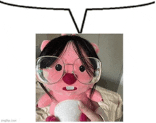 a person is holding a pink stuffed animal with glasses and a wig .