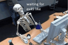 a skeleton is sitting at a desk wearing headphones and waiting for ex45 like .