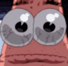 a close up of patrick star 's face with big eyes