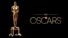 a golden statue of a man standing on top of a podium next to the oscars logo .