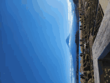 a blue sky with a mountain in the distance