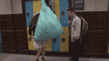 a boy and a girl are standing in front of lockers with a sign that says " word wasted "