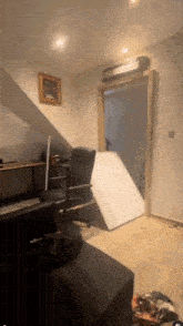 a corner of a room with a painting on the wall