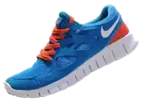 a pair of blue nike shoes with orange laces on a white background