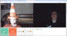 a man wearing a traffic cone hat is on a video call