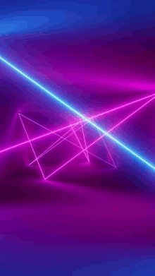 a purple and blue light beam is coming out of a triangle on a dark background .