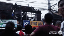 a group of people standing in front of a building that has a sign that says lutong bahay