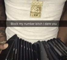 a man in a white shirt holds a stack of cell phones and says block my number bitch i dare you