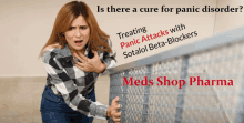 a woman in a plaid shirt is standing next to a fence with the words is there a cure for panic disorder