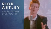 rick astley is singing into a microphone while wearing a suit and striped shirt .