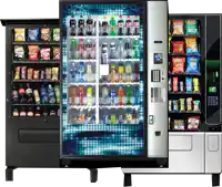 three vending machines are lined up with snacks including lays chips