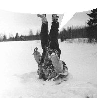 a person is upside down in the snow with their feet up