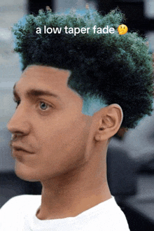 a man with a low taper fade has blue hair