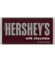 a bar of hershey 's milk chocolate is sitting on a table .