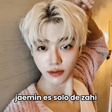 a picture of a man with the caption jaemin es solo de zahi