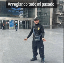 a man standing in front of the fiscalia building