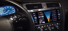 a car dashboard with a netflix app on the screen