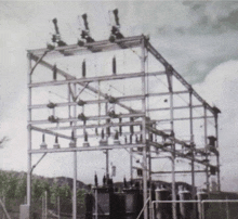 a black and white photo of a building with a lot of wires hanging from it