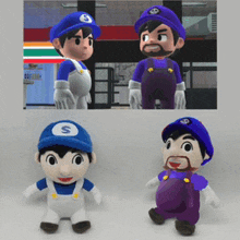 two stuffed mario brothers are standing next to each other on a table