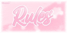 a pink background with the word rules written in white letters .