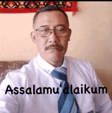 a man wearing glasses and a tie says " assalamu 'alaikum "