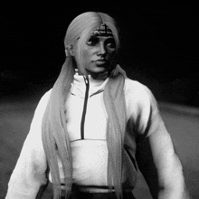 a black and white photo of a woman wearing a bandana and a white sweatshirt