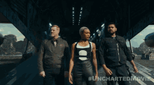 a group of people are walking in a tunnel with the hashtag #uncharteredmovie