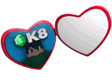 a heart shaped mirror with a picture of a man and the word k8 on it