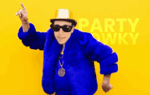 a man in a blue fur coat and gold hat is dancing in front of a yellow background that says party jewky