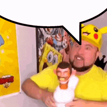 a man wearing a pikachu hat is holding a spongebob doll