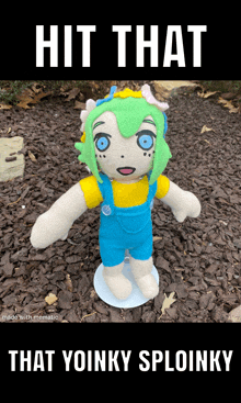 a stuffed doll with green hair and blue eyes is on a stand with a caption that says hit that that yoinky sploinky