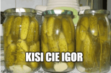 three jars of pickles with the words kisi cie igor on the top