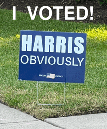 a sign that says i voted harris obviously on it