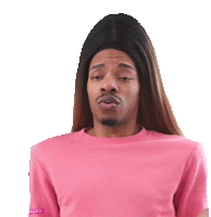 a man with long hair and a pink shirt is wearing a wig