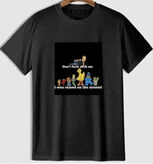 a black t-shirt with a picture of sesame street characters on it