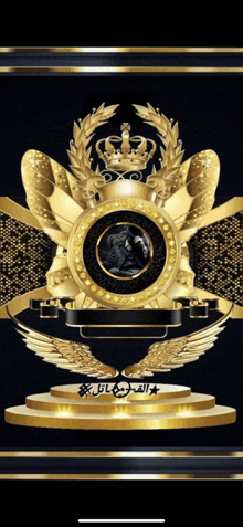 a black and gold emblem with a crown and wings